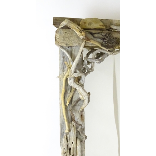 1598 - An early 20thC driftwood mirror. 64