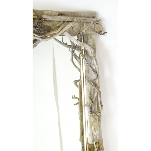 1598 - An early 20thC driftwood mirror. 64