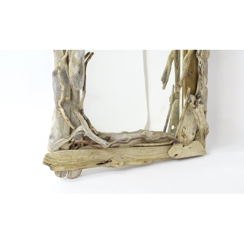 1598 - An early 20thC driftwood mirror. 64