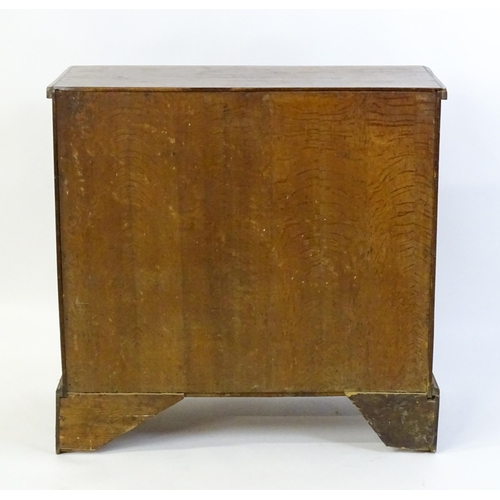 1602 - A late Georgian fruitwood chest of drawers comprising two short over three long drawers raised on sh... 