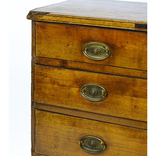 1602 - A late Georgian fruitwood chest of drawers comprising two short over three long drawers raised on sh... 