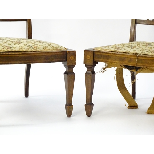 1603 - A pair of Edwardian walnut side chairs with satinwood marquetry decoration raised on tapering legs t... 