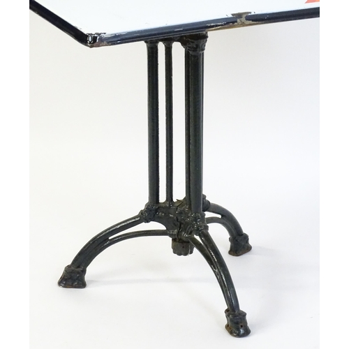 1606 - An early 20thC cast iron based pub / cafe / bistro table, with squared advertising top marked Carta ... 