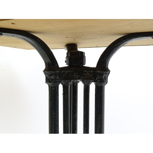 1606 - An early 20thC cast iron based pub / cafe / bistro table, with squared advertising top marked Carta ... 