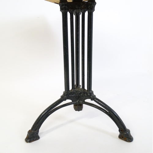 1606 - An early 20thC cast iron based pub / cafe / bistro table, with squared advertising top marked Carta ... 