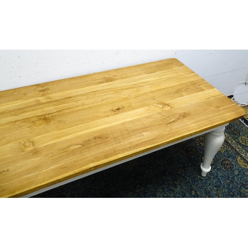 1615 - A late 20thC dining / refectory table with a planked top above a painted base and four baluster turn... 