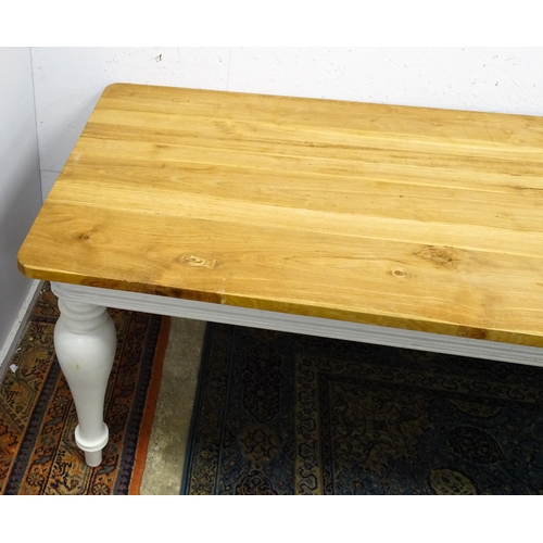 1615 - A late 20thC dining / refectory table with a planked top above a painted base and four baluster turn... 