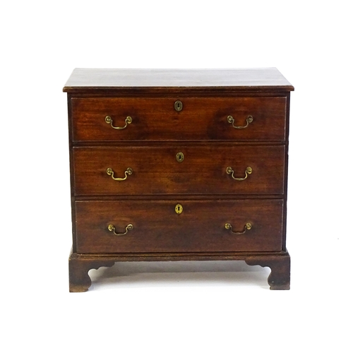 1633 - A late 18thC / early 19thC mahogany chest of drawers comprising a rectangular moulded top above thre... 