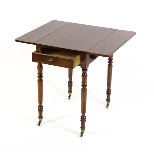 1635 - A mid / late 19thC mahogany Pembroke table with drop flaps to either side,  a single small frieze dr... 