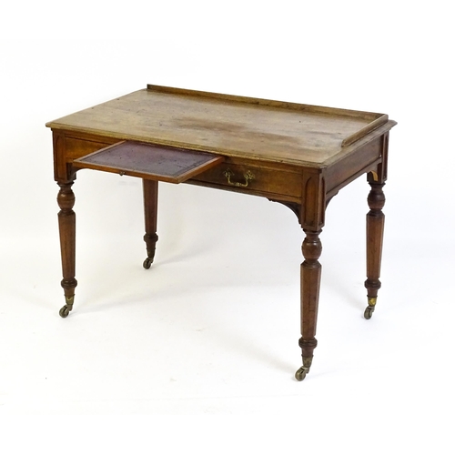 1636 - A 19thC walnut Gothic desk by Hindley & Sons of Oxford St, London with a shaped upstand above two sh... 