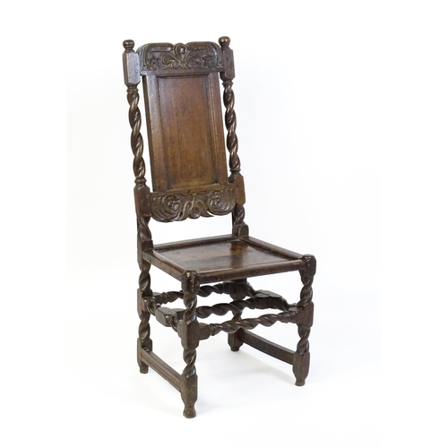 1639 - A late 17thC oak back stool with a carved cresting rail and turned uprights alongside a panel back a... 