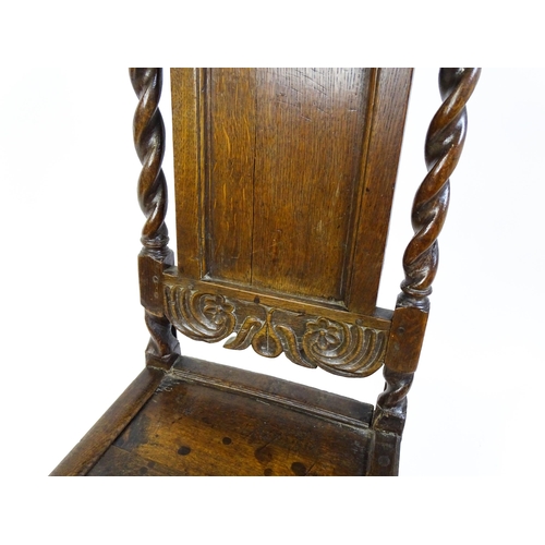 1639 - A late 17thC oak back stool with a carved cresting rail and turned uprights alongside a panel back a... 