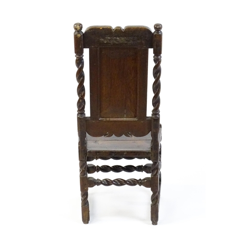 1639 - A late 17thC oak back stool with a carved cresting rail and turned uprights alongside a panel back a... 