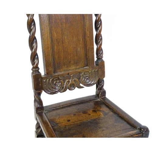 1639 - A late 17thC oak back stool with a carved cresting rail and turned uprights alongside a panel back a... 