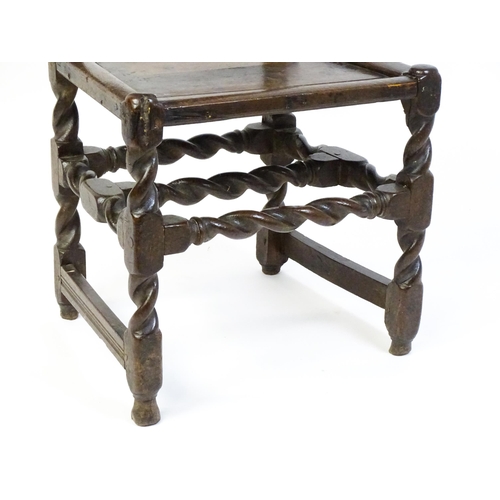 1639 - A late 17thC oak back stool with a carved cresting rail and turned uprights alongside a panel back a... 