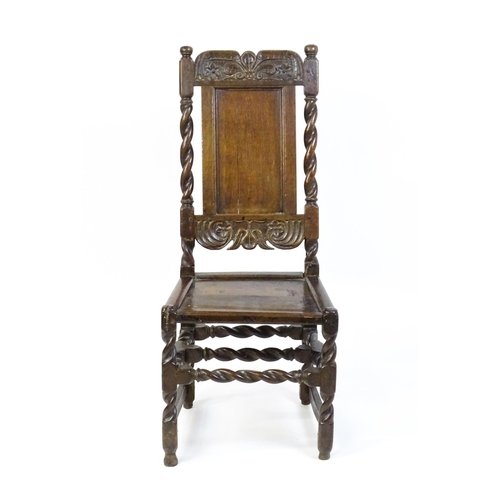 1639 - A late 17thC oak back stool with a carved cresting rail and turned uprights alongside a panel back a... 