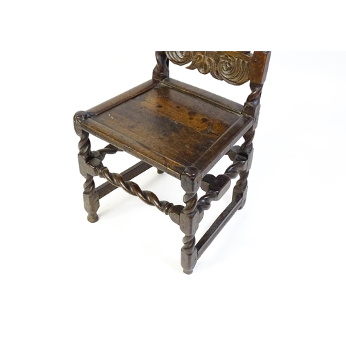 1639 - A late 17thC oak back stool with a carved cresting rail and turned uprights alongside a panel back a... 