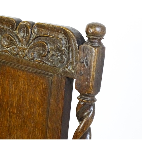 1639 - A late 17thC oak back stool with a carved cresting rail and turned uprights alongside a panel back a... 