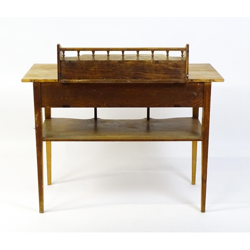 1642 - A late 19thC Aesthetic desk with a gallery and small drawer surmounting the top, the frieze having a... 