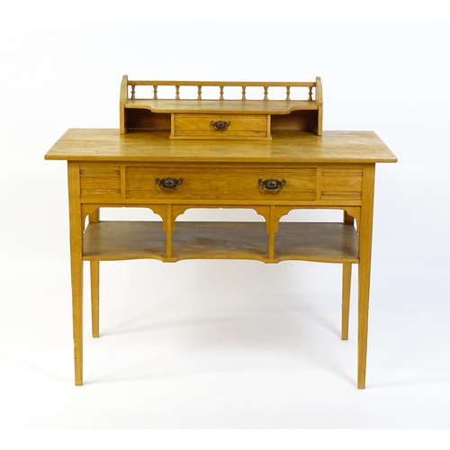 1642 - A late 19thC Aesthetic desk with a gallery and small drawer surmounting the top, the frieze having a... 