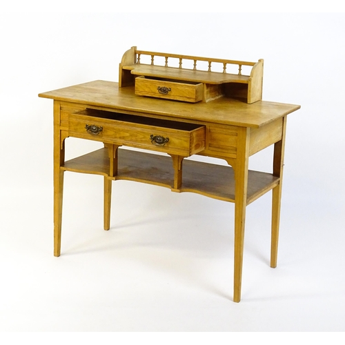 1642 - A late 19thC Aesthetic desk with a gallery and small drawer surmounting the top, the frieze having a... 