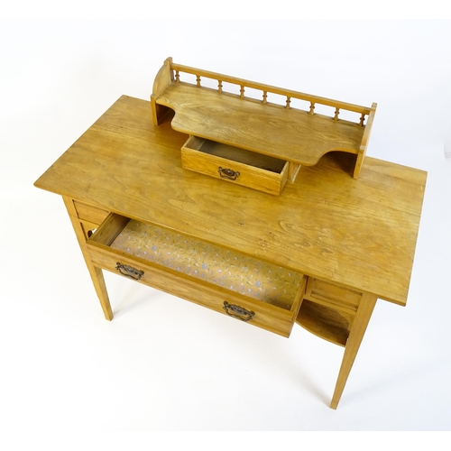 1642 - A late 19thC Aesthetic desk with a gallery and small drawer surmounting the top, the frieze having a... 