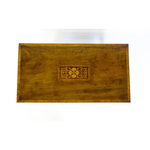 1643 - An early / mid 20thC mahogany coffee table with floral marquetry inlay and a crossbanded top raised ... 