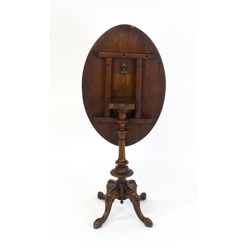 1650 - A late 19th / early 20thC walnut occasional table with an oval burr walnut top and a satinwood marqu... 