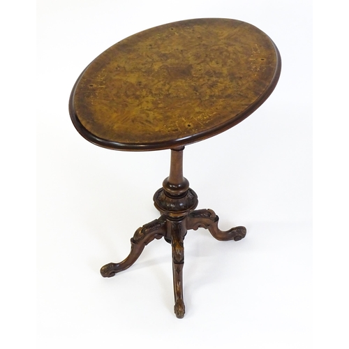 1650 - A late 19th / early 20thC walnut occasional table with an oval burr walnut top and a satinwood marqu... 