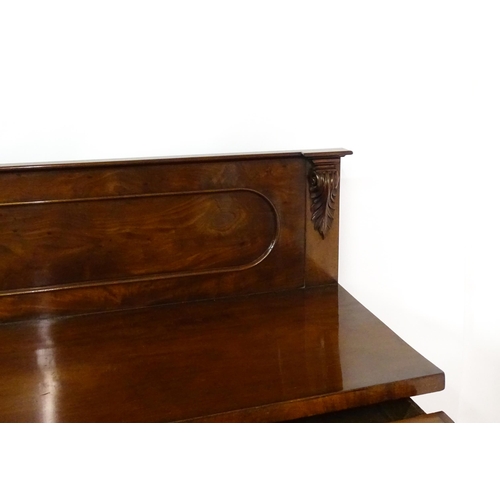 1653 - A Victorian mahogany double pedestal sideboard with a panelled upstand, acanthus carved brackets and... 