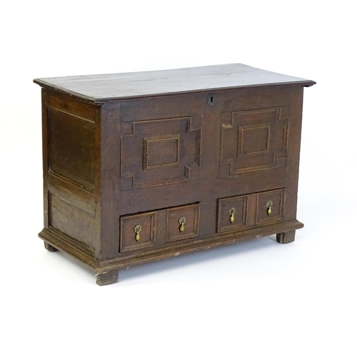 1654 - A late 17thC mule chest with a hinged lid above a planked top, panelled sides and geometric moulding... 