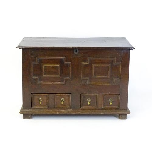 1654 - A late 17thC mule chest with a hinged lid above a planked top, panelled sides and geometric moulding... 