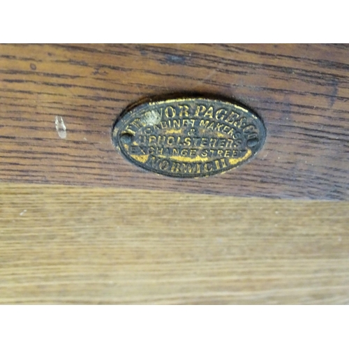 1655 - An early 20thC Trevor Page & Co of Norwich writing desk, with a gold tooled leather top above a sing... 