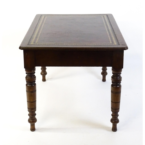 1655 - An early 20thC Trevor Page & Co of Norwich writing desk, with a gold tooled leather top above a sing... 