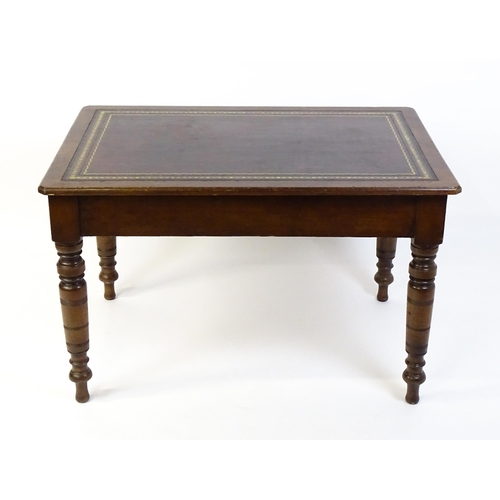 1655 - An early 20thC Trevor Page & Co of Norwich writing desk, with a gold tooled leather top above a sing... 