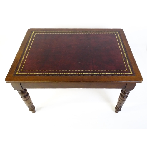 1655 - An early 20thC Trevor Page & Co of Norwich writing desk, with a gold tooled leather top above a sing... 