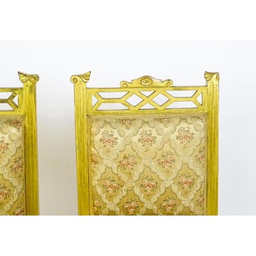 1656 - A pair of early 20thC giltwood nursing chairs with Anglo-Japanese pierced design elements and raised... 