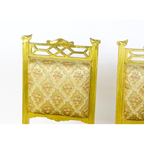 1656 - A pair of early 20thC giltwood nursing chairs with Anglo-Japanese pierced design elements and raised... 