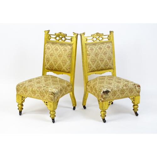 1656 - A pair of early 20thC giltwood nursing chairs with Anglo-Japanese pierced design elements and raised... 