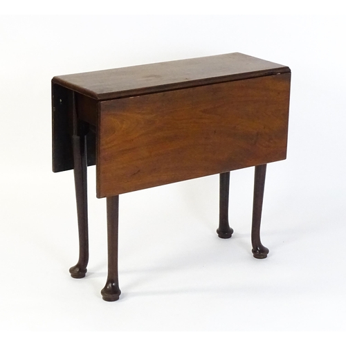 1657 - A 19thC mahogany drop flap table raised on four cabriole legs terminating in pad feet. 30