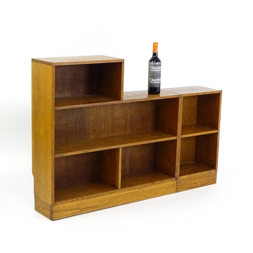 1669 - An early / mid 20thC Art Deco style oak bookcase with an open fronted shelves in six sections. 47