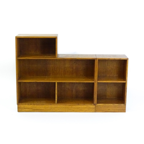 1669 - An early / mid 20thC Art Deco style oak bookcase with an open fronted shelves in six sections. 47