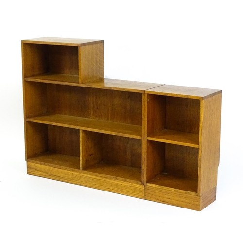 1669 - An early / mid 20thC Art Deco style oak bookcase with an open fronted shelves in six sections. 47