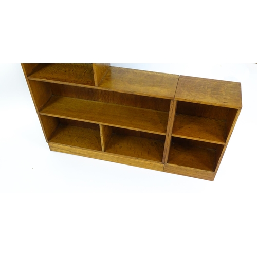 1669 - An early / mid 20thC Art Deco style oak bookcase with an open fronted shelves in six sections. 47