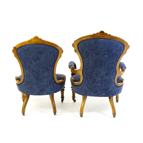 1679 - Two Victorian walnut chairs a fluted frame, carved rosettes and deep buttoned backrests above sprung... 