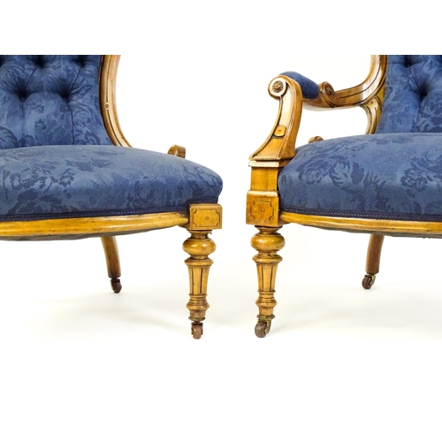 1679 - Two Victorian walnut chairs a fluted frame, carved rosettes and deep buttoned backrests above sprung... 