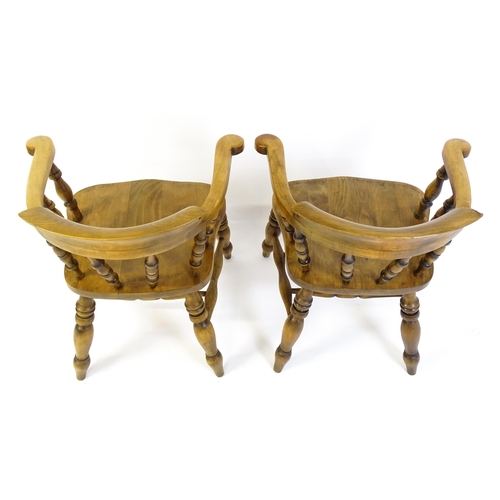 1682 - A pair of mid / late 20thC smokers bow chairs / captains chairs, with bowed backs, turned supports, ... 