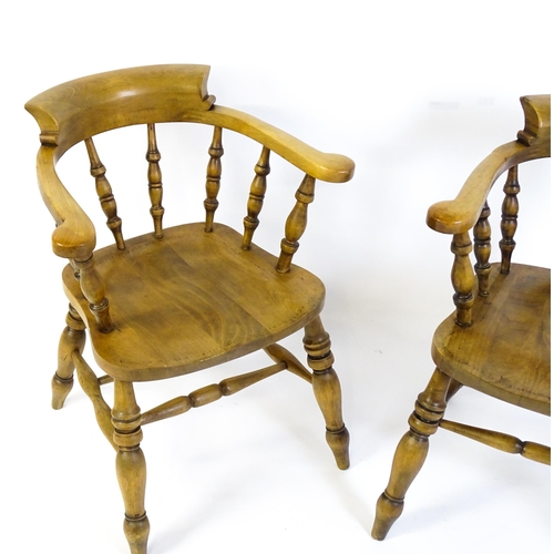 1682 - A pair of mid / late 20thC smokers bow chairs / captains chairs, with bowed backs, turned supports, ... 