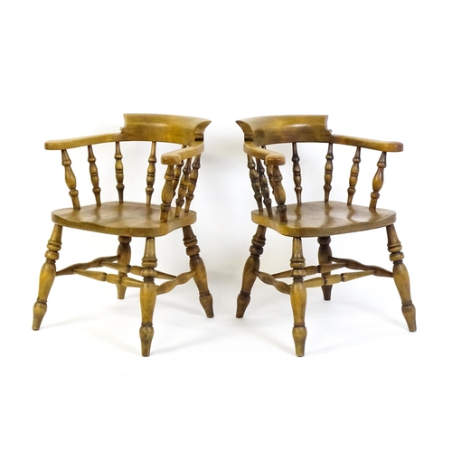 1682 - A pair of mid / late 20thC smokers bow chairs / captains chairs, with bowed backs, turned supports, ... 