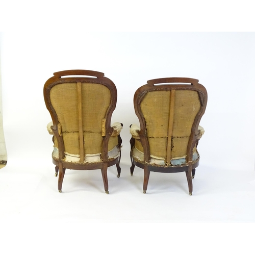 1690 - A pair of 19thC mahogany armchairs for re-upholstery, the chairs having spoon backs, manchettes and ... 